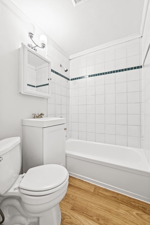 27 Bailey Street Boston, MA 02124 - Photo 12 of 35 a bathroom with a toilet a sink and bathtub