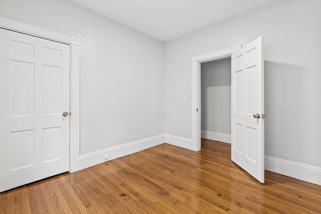 27 Bailey Street Boston, MA 02124 - Photo 13 of 35 wooden floor in an empty room