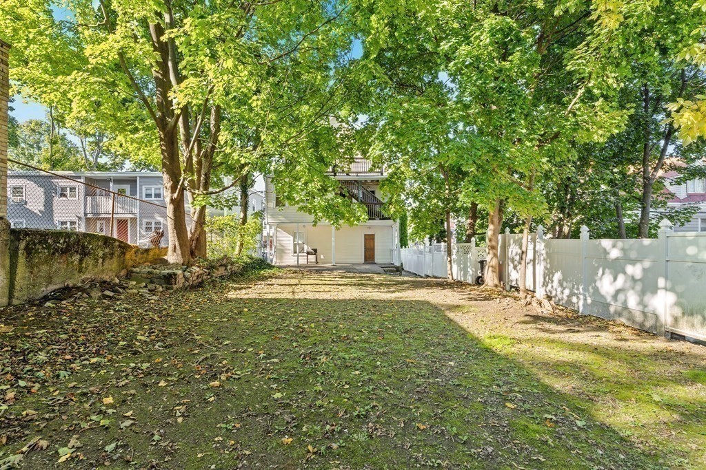 27 Bailey Street Boston, MA 02124 - Photo 14 of 35 a view of a house with backyard and tree