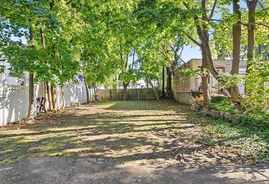 27 Bailey Street Boston, MA 02124 - Photo 18 of 35 a view of a yard in front of a house