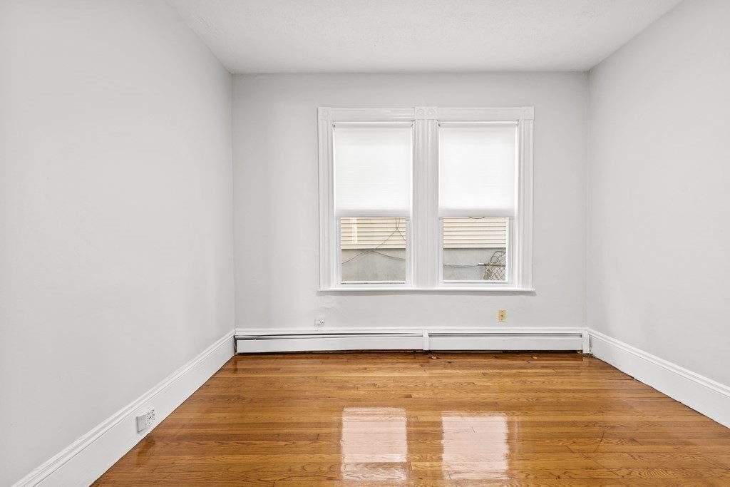 27 Bailey Street Boston, MA 02124 - Photo 21 of 35 a view of an empty room with a window