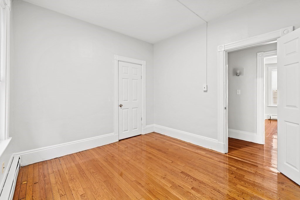 27 Bailey Street Boston, MA 02124 - Photo 22 of 35 a view of empty room with wooden floor