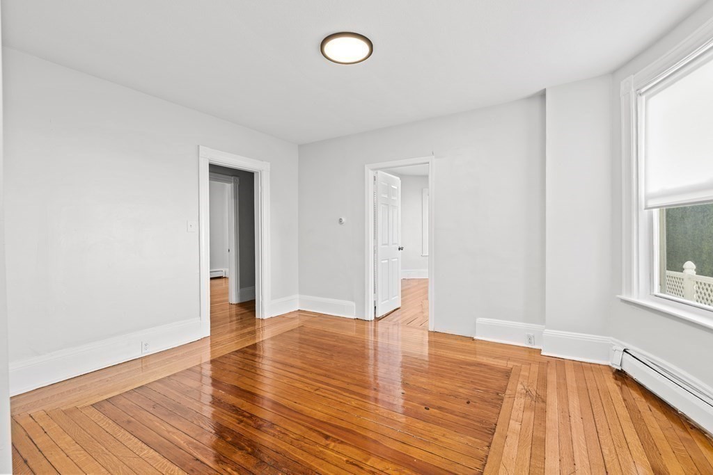 27 Bailey Street Boston, MA 02124 - Photo 24 of 35 a view of empty room with wooden floor