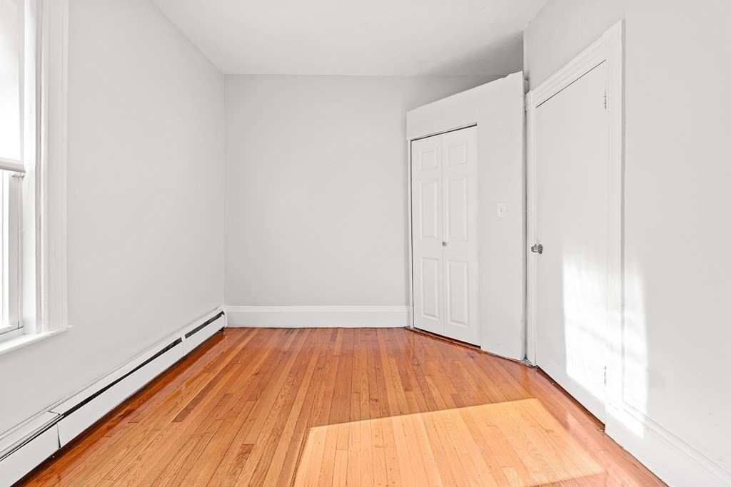 27 Bailey Street Boston, MA 02124 - Photo 28 of 35 a view of a room with wooden floor