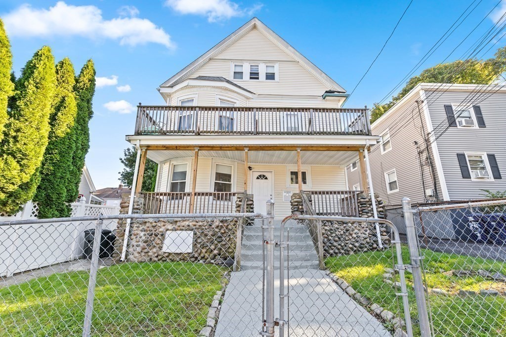 27 Bailey Street Boston, MA 02124 - Photo 3 of 35 a front view of a house with garden