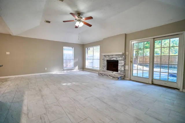a view of an empty room with a window
