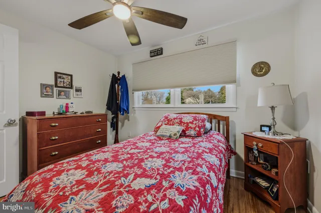 a bedroom with a bed and a bookshelf