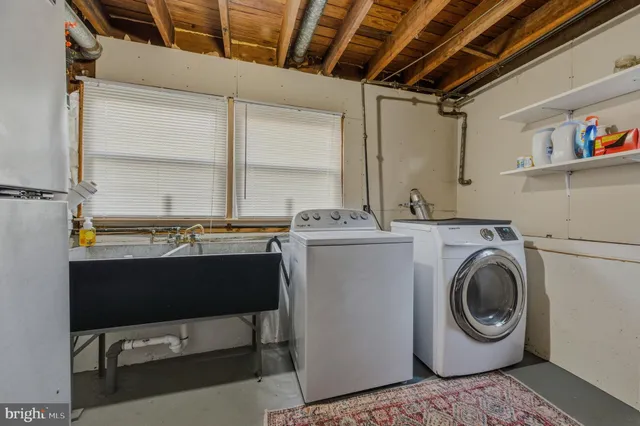 a utility room with dryer and washer