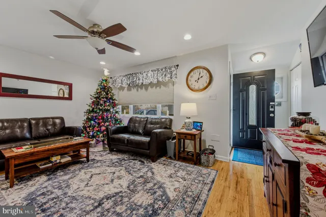 a living room with furniture and a clock