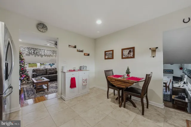 a living room with furniture and a gym machine