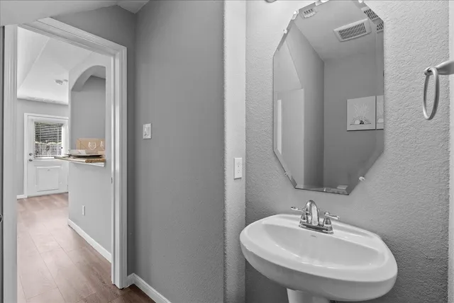 a bathroom with a sink and a mirror