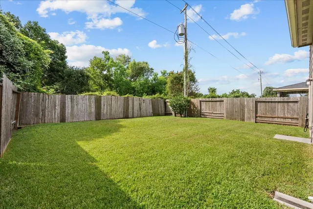 a view of a backyard with green space
