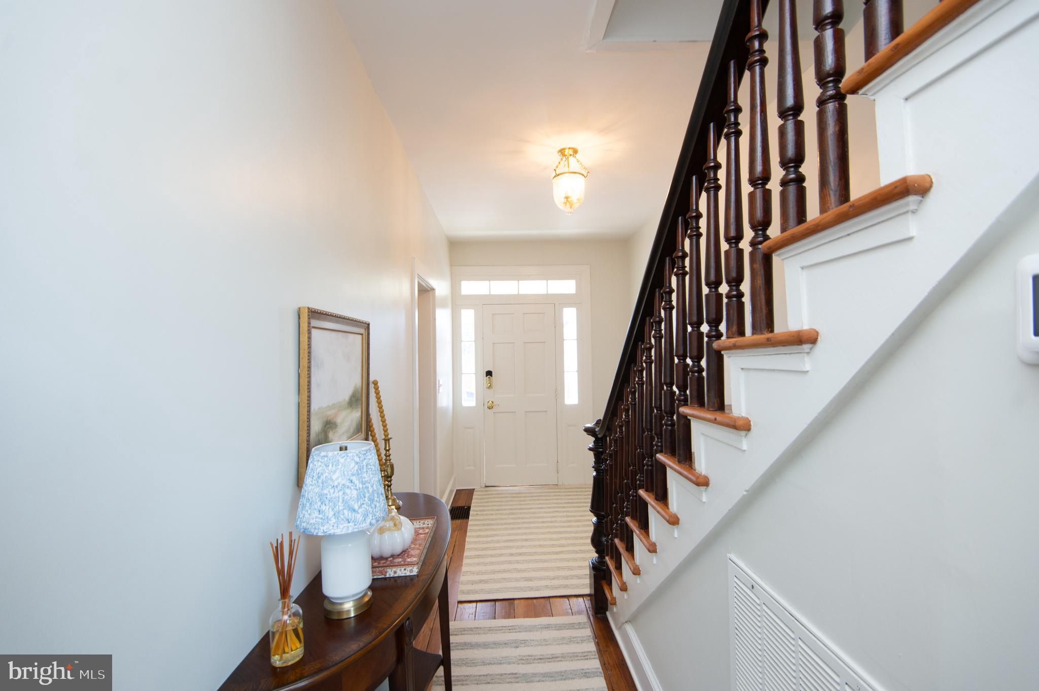 533 South Street Easton, MD 21601 - Photo 11 of 47 a view of entryway with wooden floor and stairs