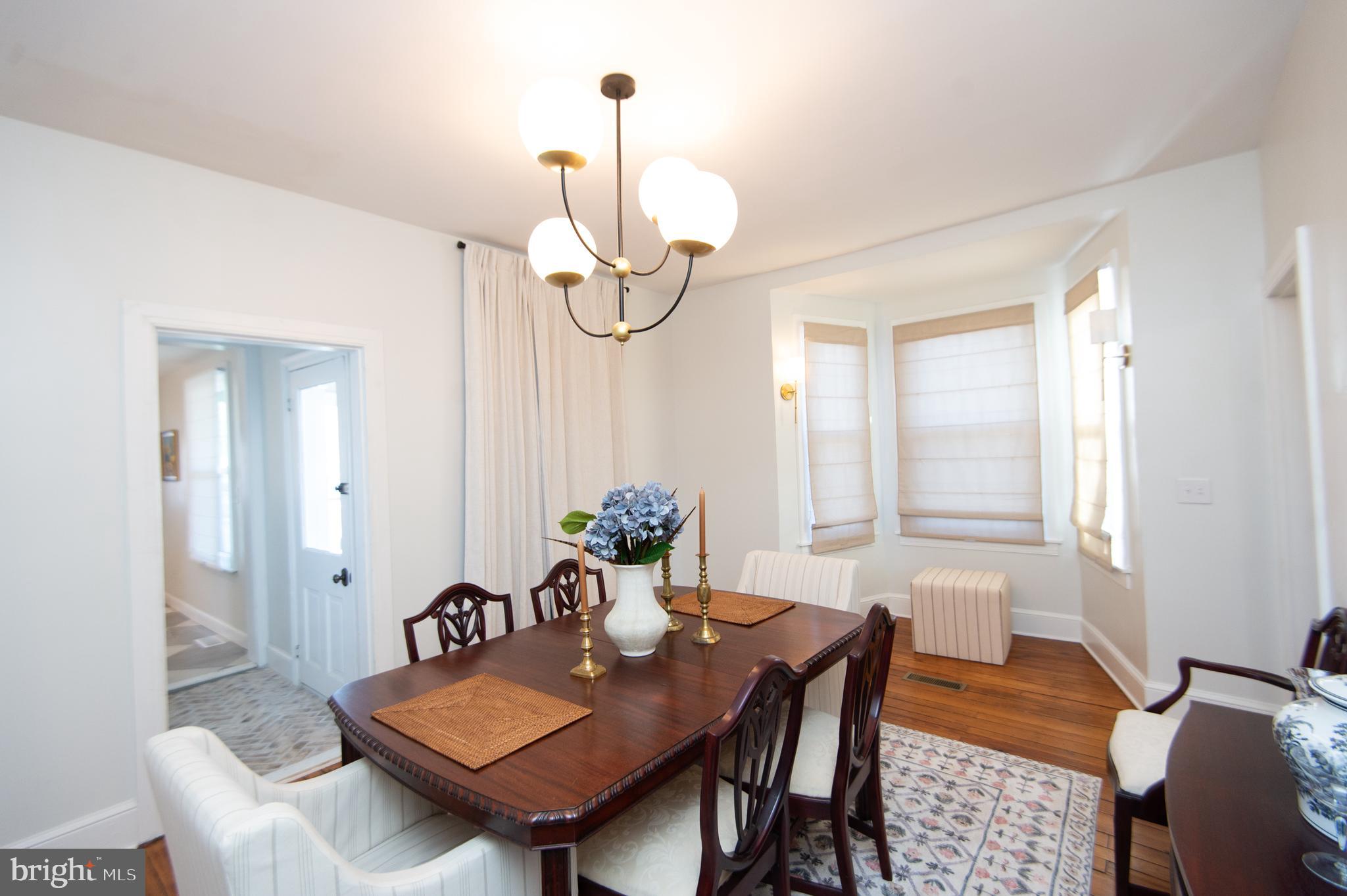533 South Street Easton, MD 21601 - Photo 16 of 47 a view of a dining room with furniture window and wooden floor