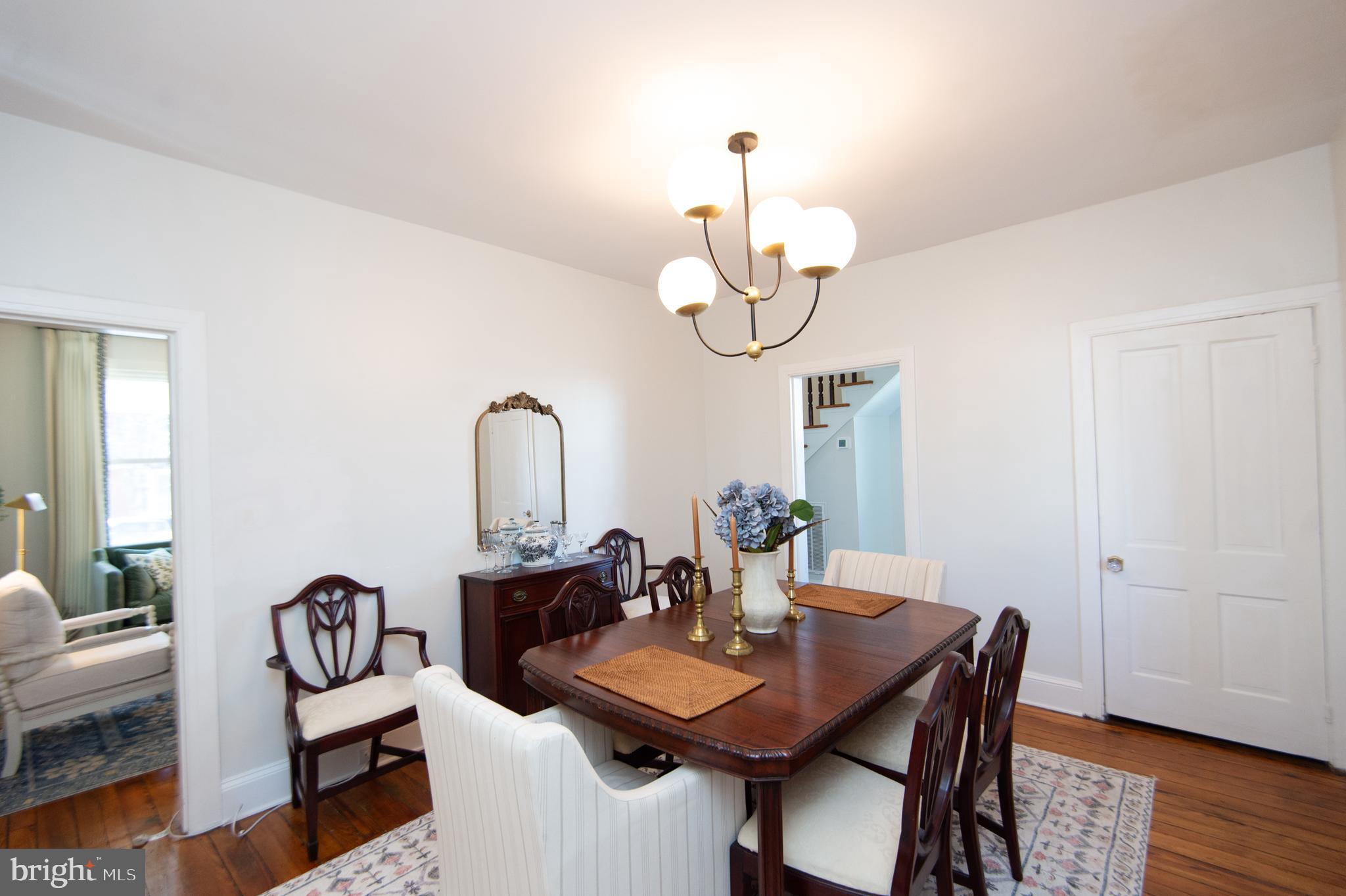 533 South Street Easton, MD 21601 - Photo 18 of 47 a view of a dining room with furniture wooden floor and chandelier