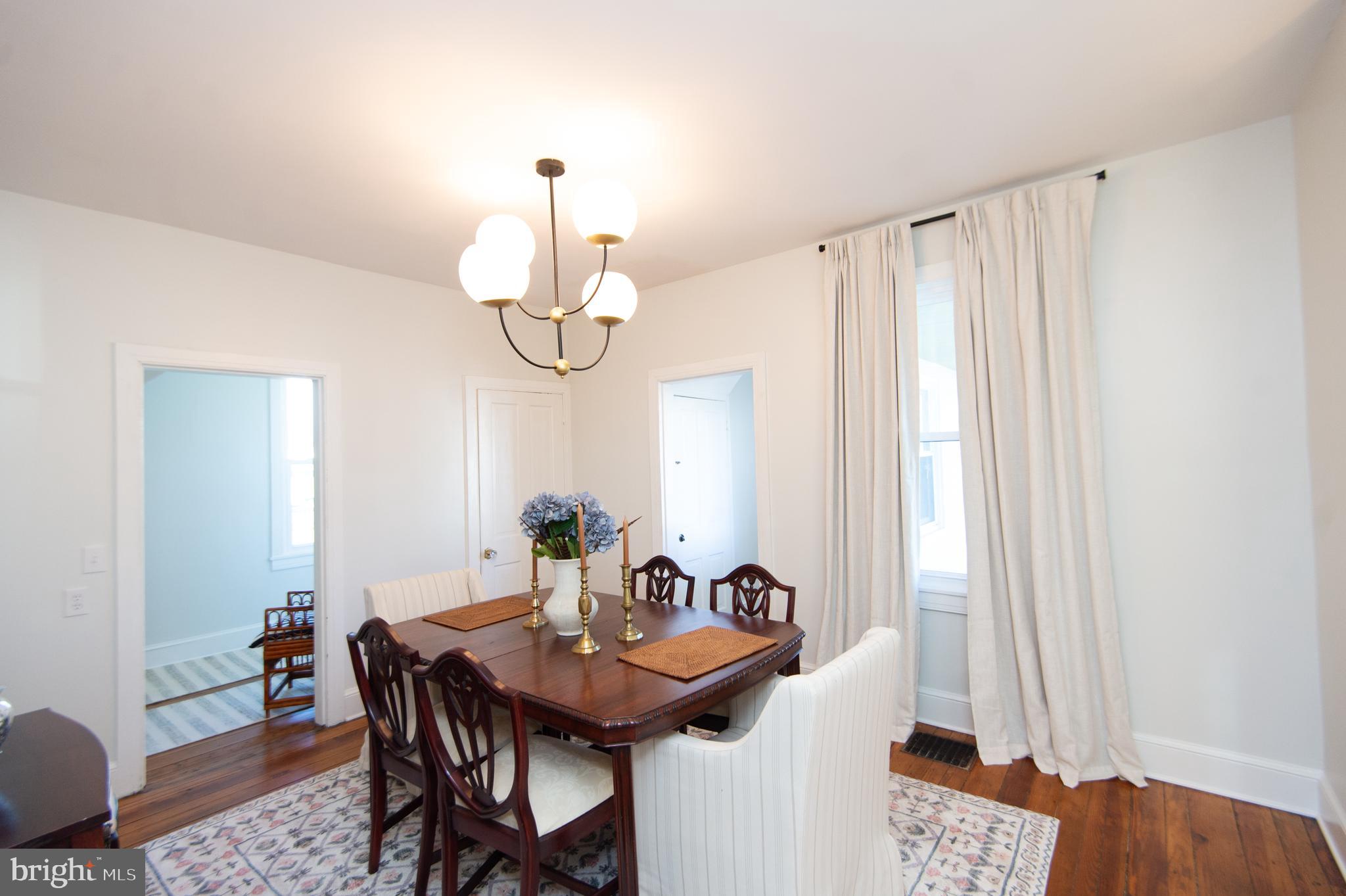 533 South Street Easton, MD 21601 - Photo 19 of 47 a view of a dining room with furniture and wooden floor