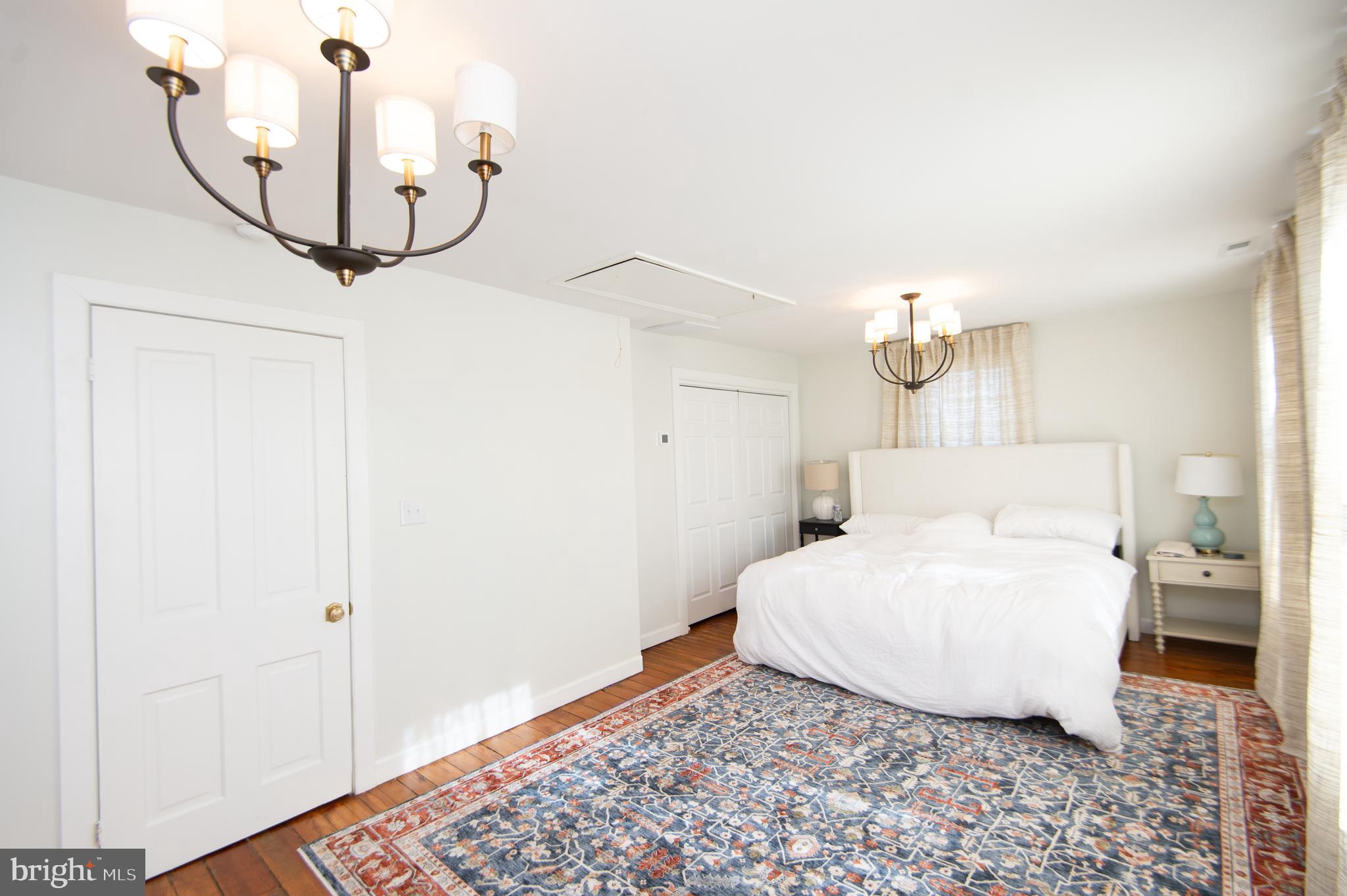 533 South Street Easton, MD 21601 - Photo 29 of 47 a bedroom with a bed and wooden floor