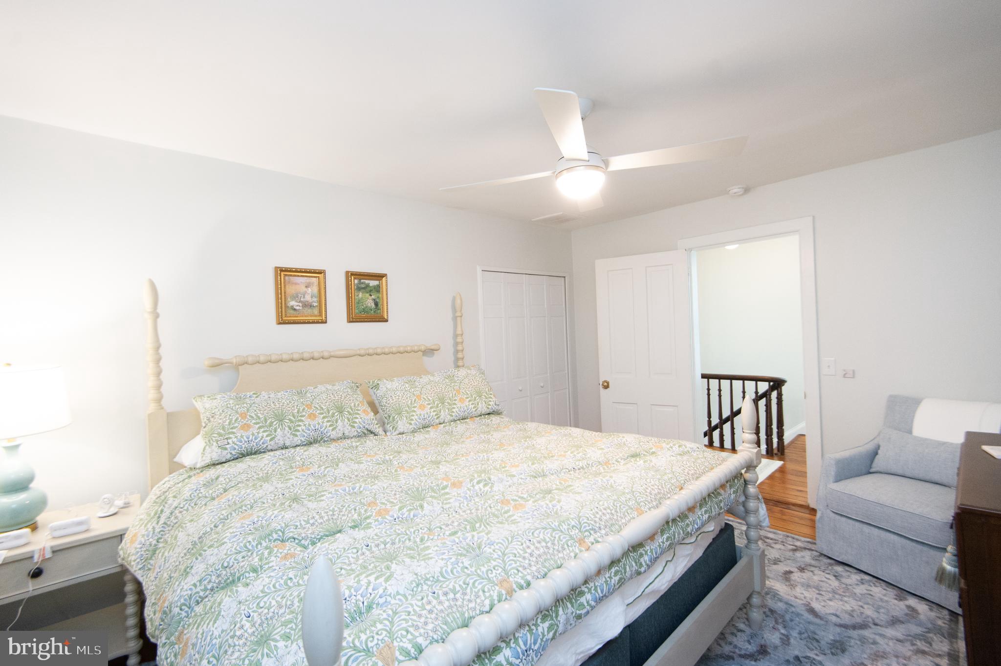 533 South Street Easton, MD 21601 - Photo 35 of 47 a bedroom with a large bed and a couch
