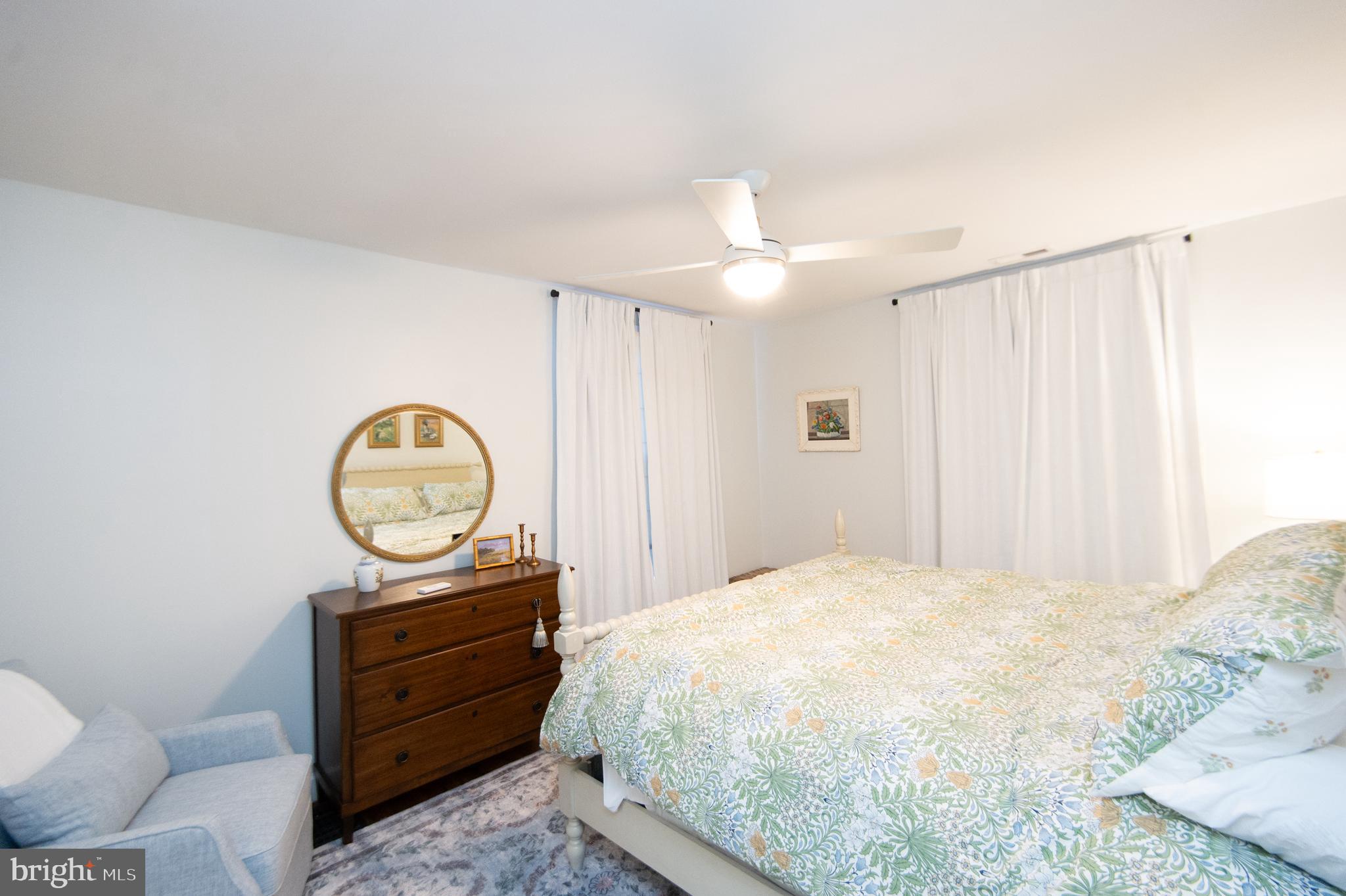 533 South Street Easton, MD 21601 - Photo 37 of 47 a bedroom with a bed and a mirror