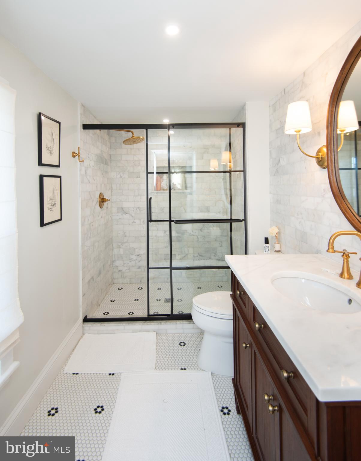533 South Street Easton, MD 21601 - Photo 39 of 47 a bathroom with a sink a toilet and mirror