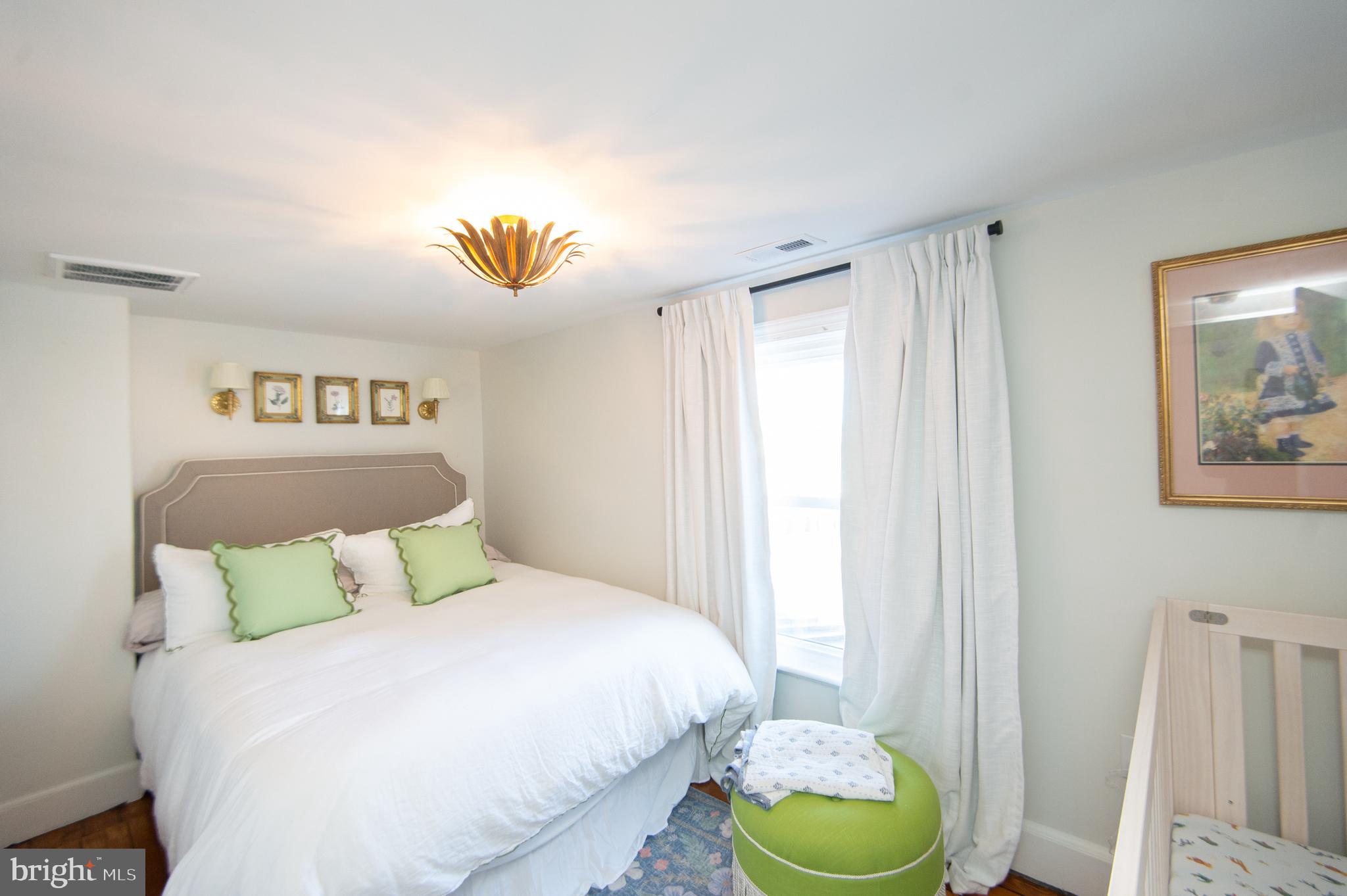 533 South Street Easton, MD 21601 - Photo 40 of 47 a bedroom with a bed and a window