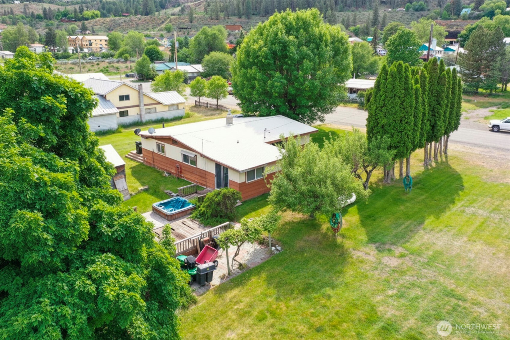 518 Bridge Street Twisp, WA 98856 - Photo 6 of 40 a picture of houses with outdoor space and trees