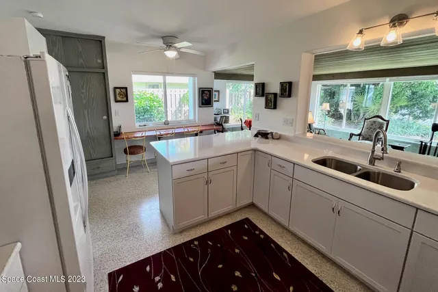 a bedroom with a bed rug and dresser