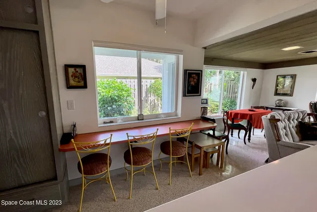a bedroom with bed and a window