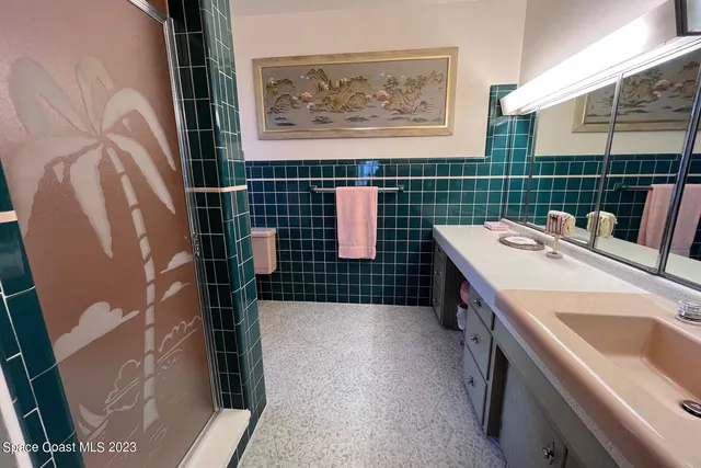 a backyard of a house with outdoor seating and trees