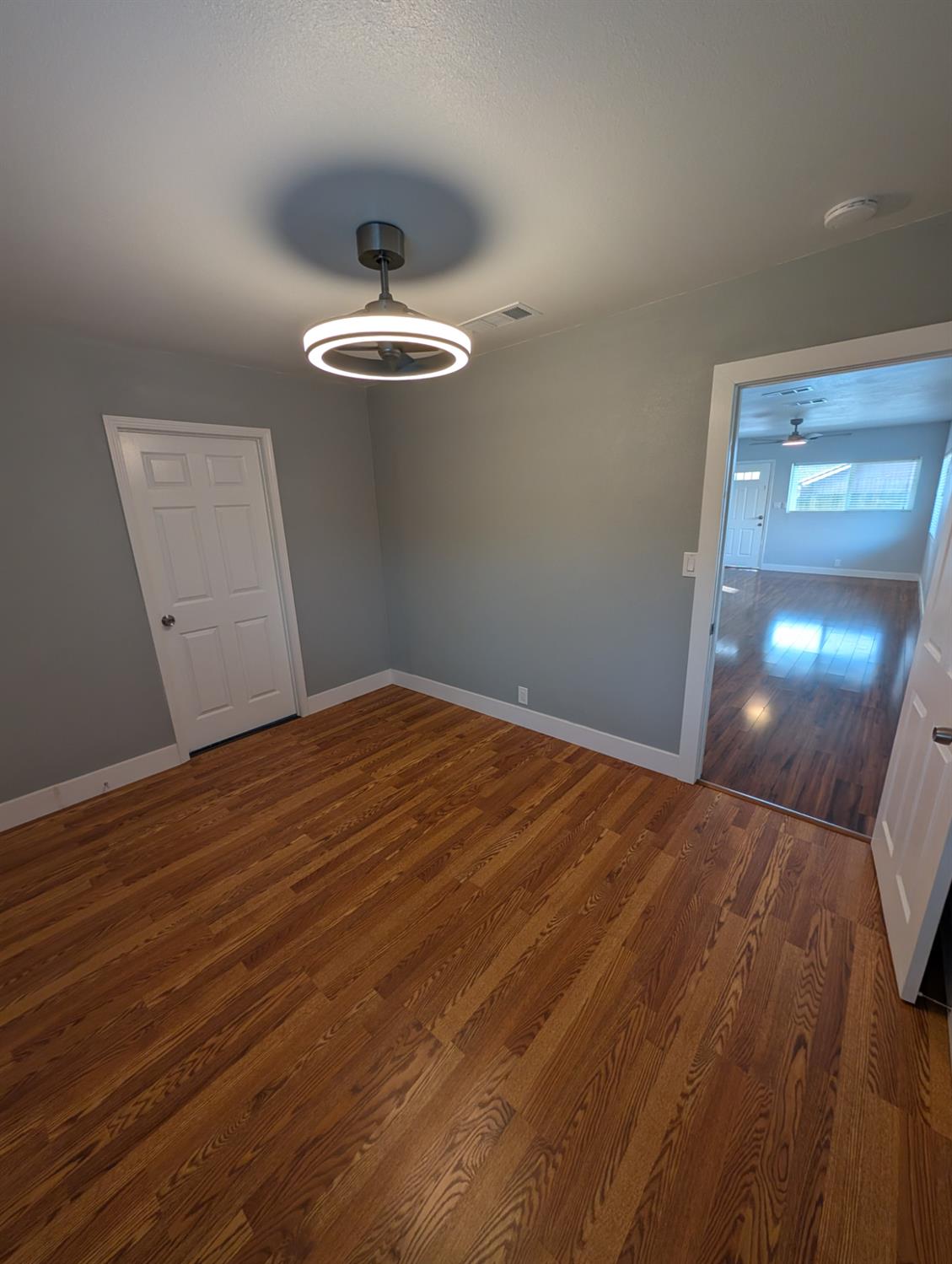 512 Sunset Street Coalinga, CA 93210 - Photo 16 of 24 a view of empty room with wooden floor