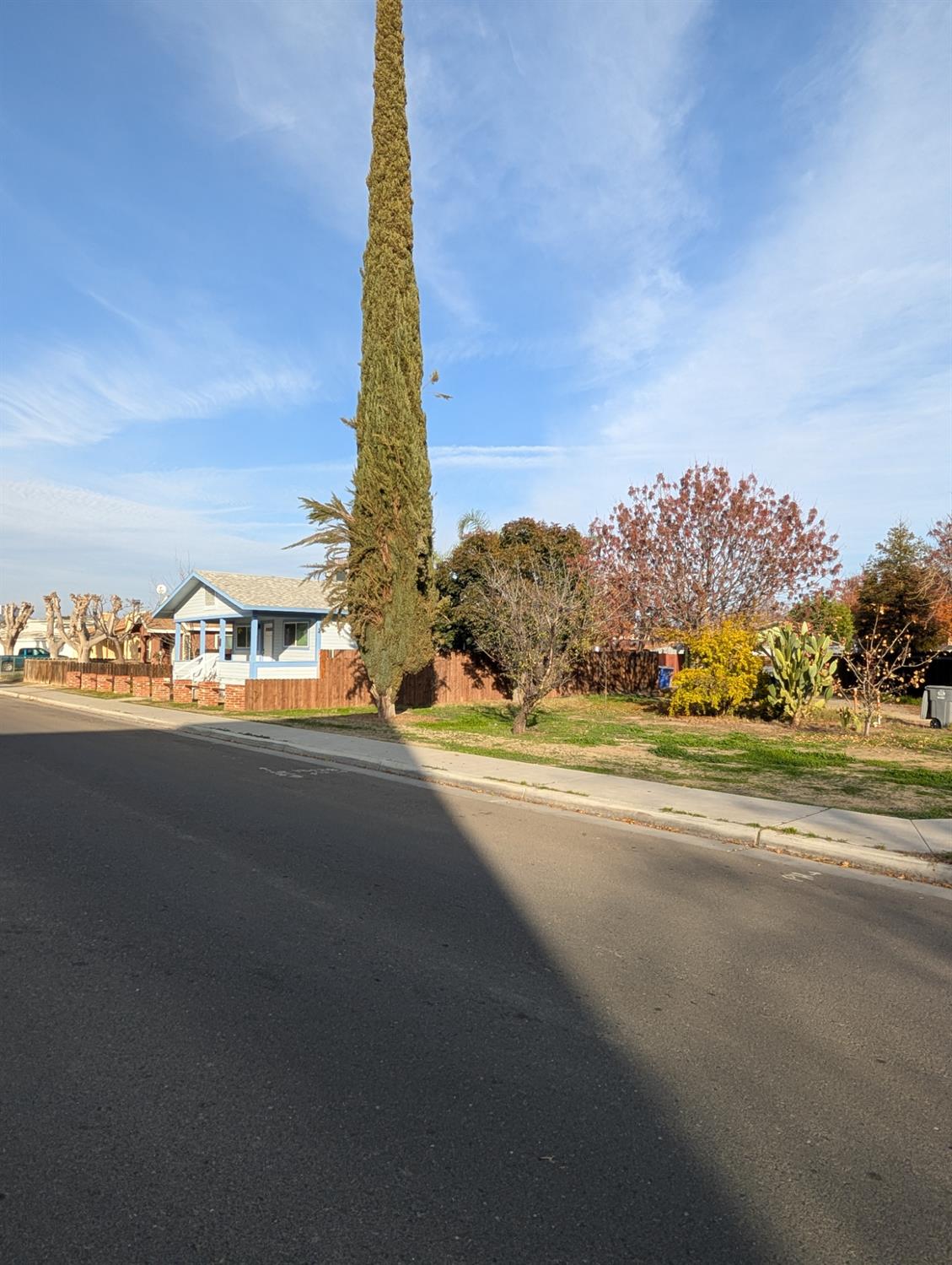 512 Sunset Street Coalinga, CA 93210 - Photo 4 of 24 a view of a city street with a building in the background