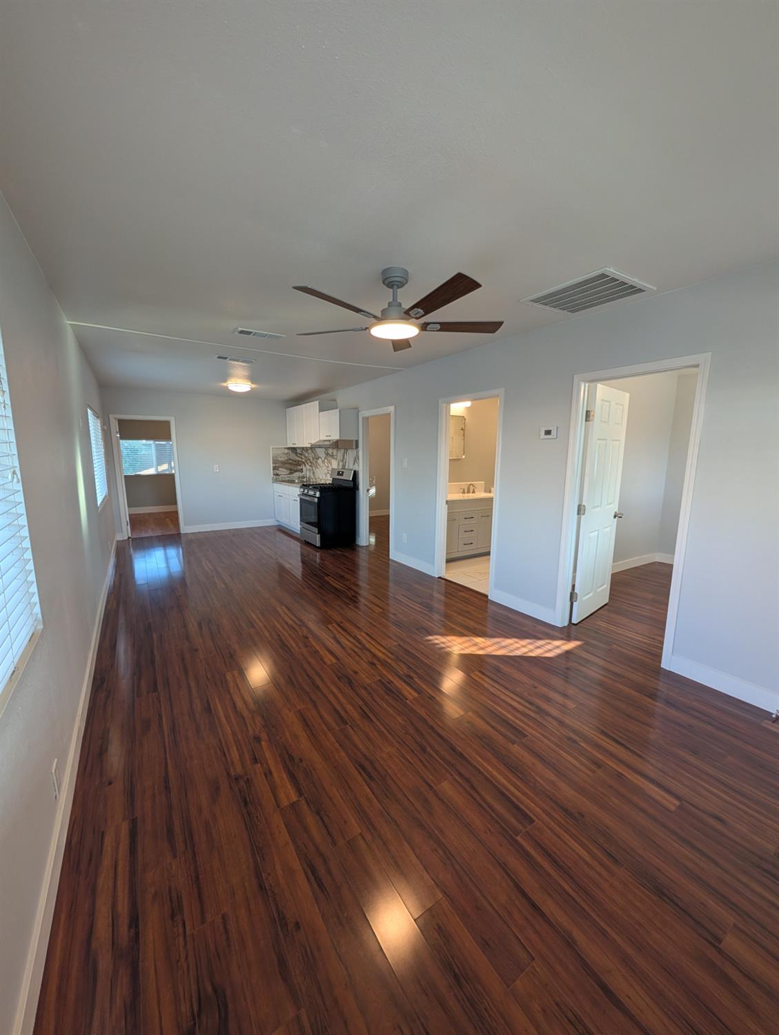 512 Sunset Street Coalinga, CA 93210 - Photo 9 of 24 a view of an empty room and wooden floor
