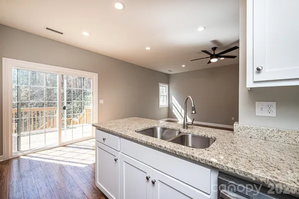 a kitchen with a sink and cabinets