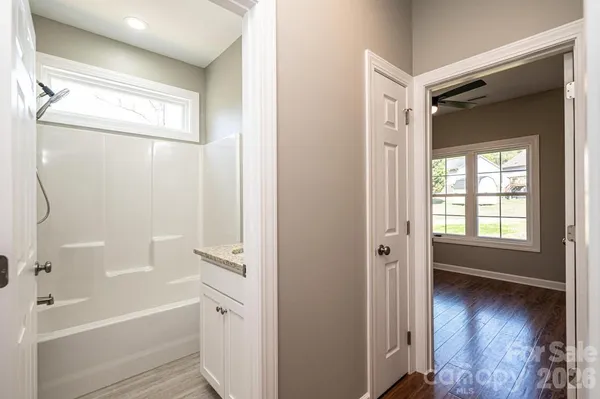 a bathroom with a bathtub and a shower