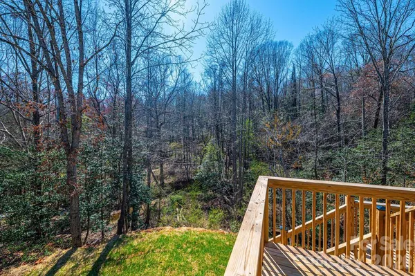 a view of a roof deck with two trees