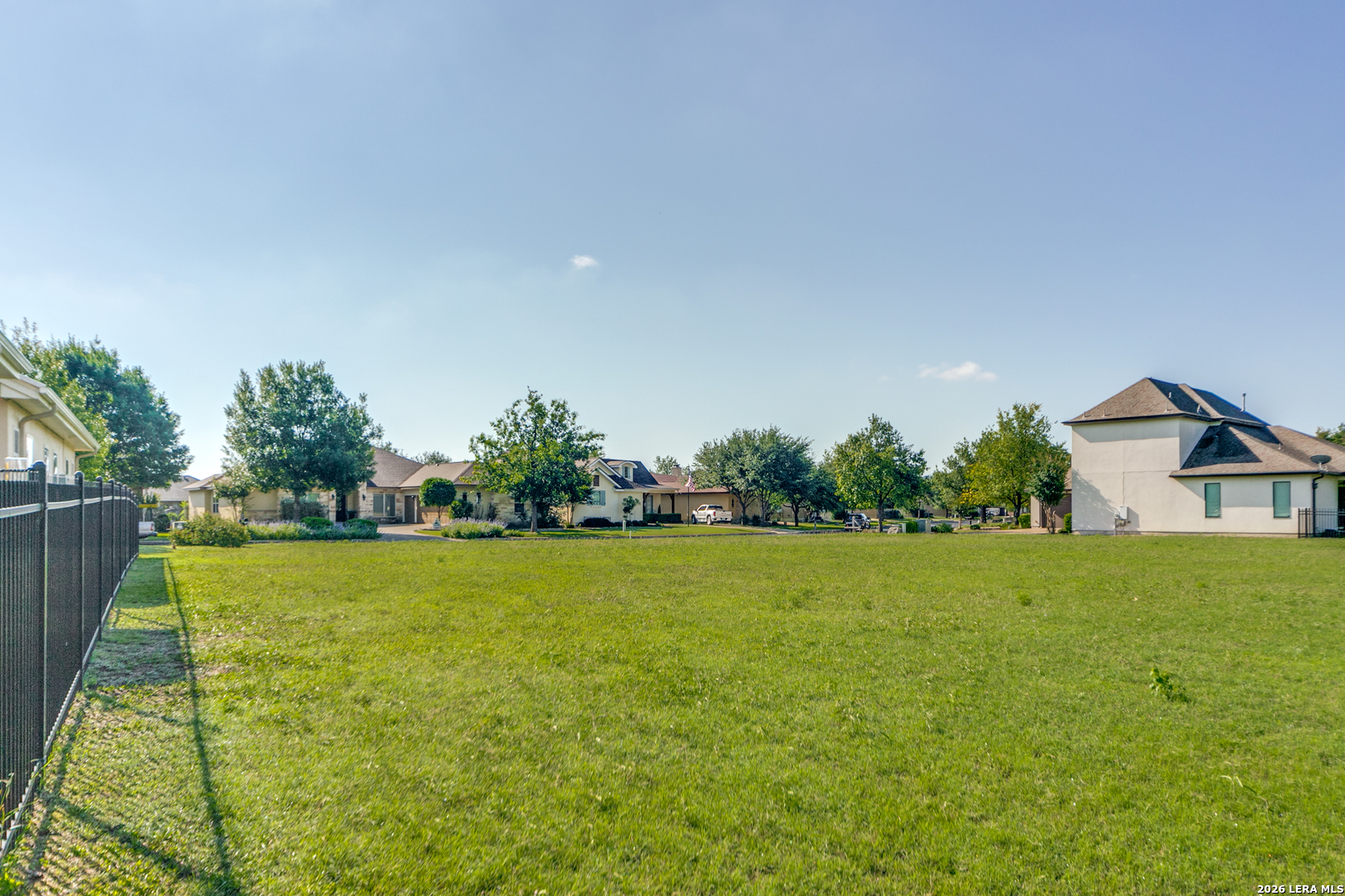 30039 Cibolo Path Fair Oaks Ranch, TX 78015 - Photo 6 of 11 a view of a big yard with plants and large trees