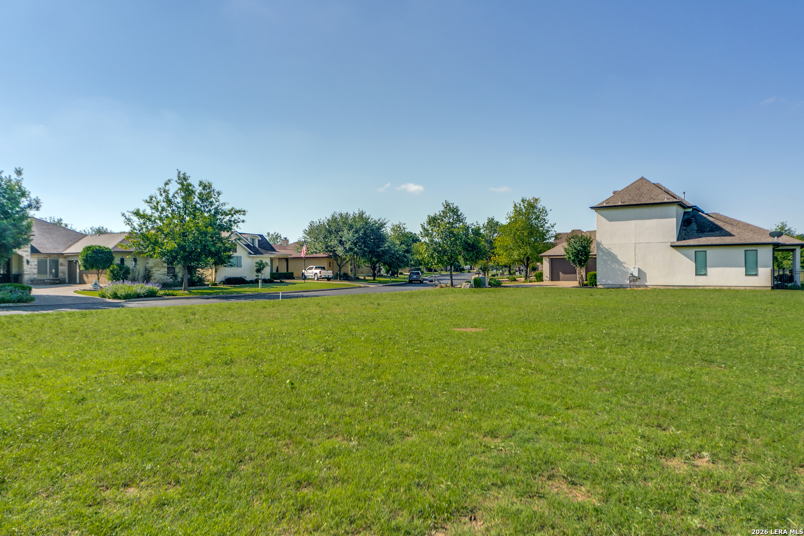 30039 Cibolo Path Fair Oaks Ranch, TX 78015 - Photo 7 of 11 a front view of house with yard and trees in the background