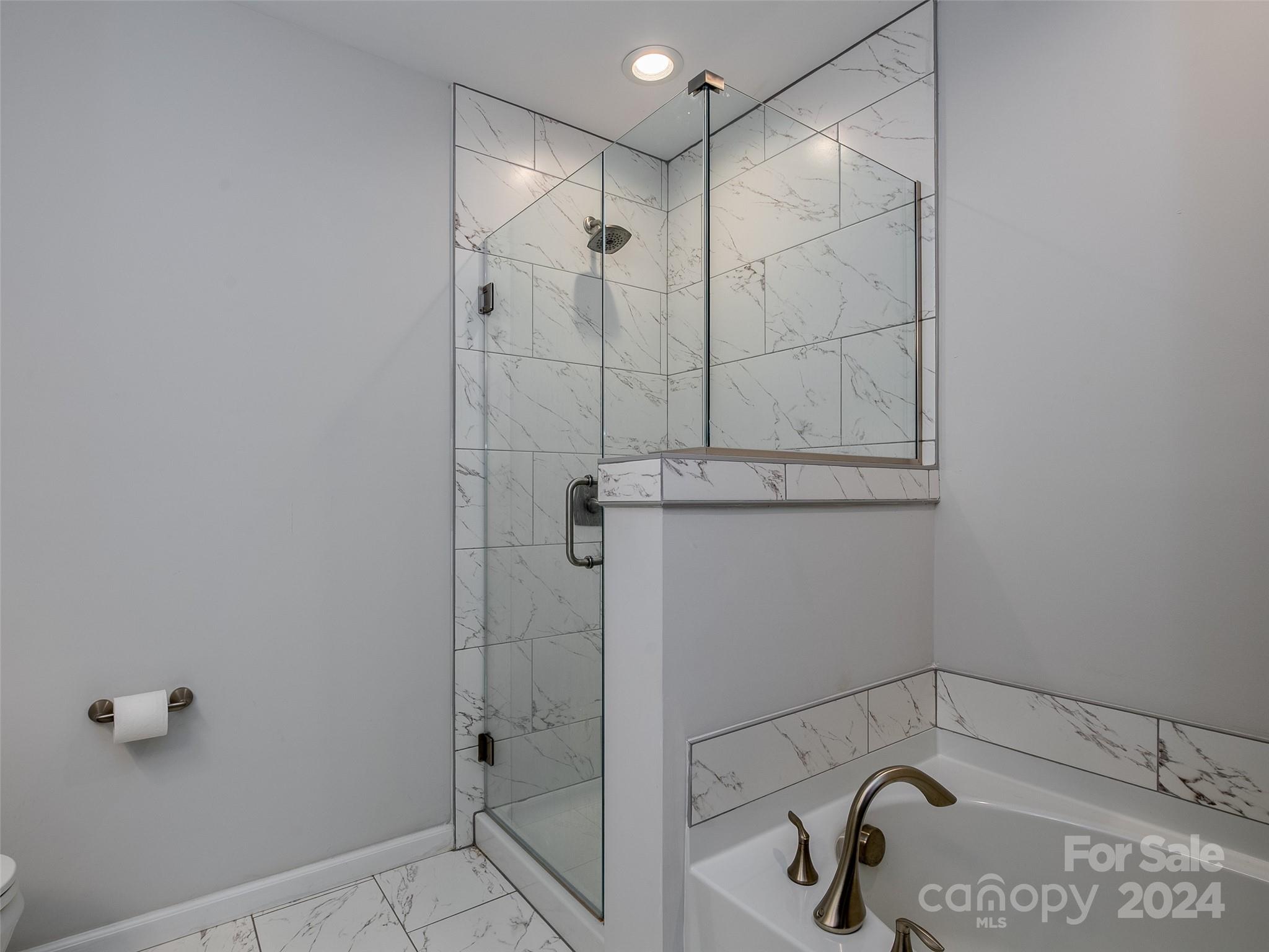 1122 Rhyne Road Charlotte, NC 28214 - Photo 13 of 22 a bathroom with a shower and tub