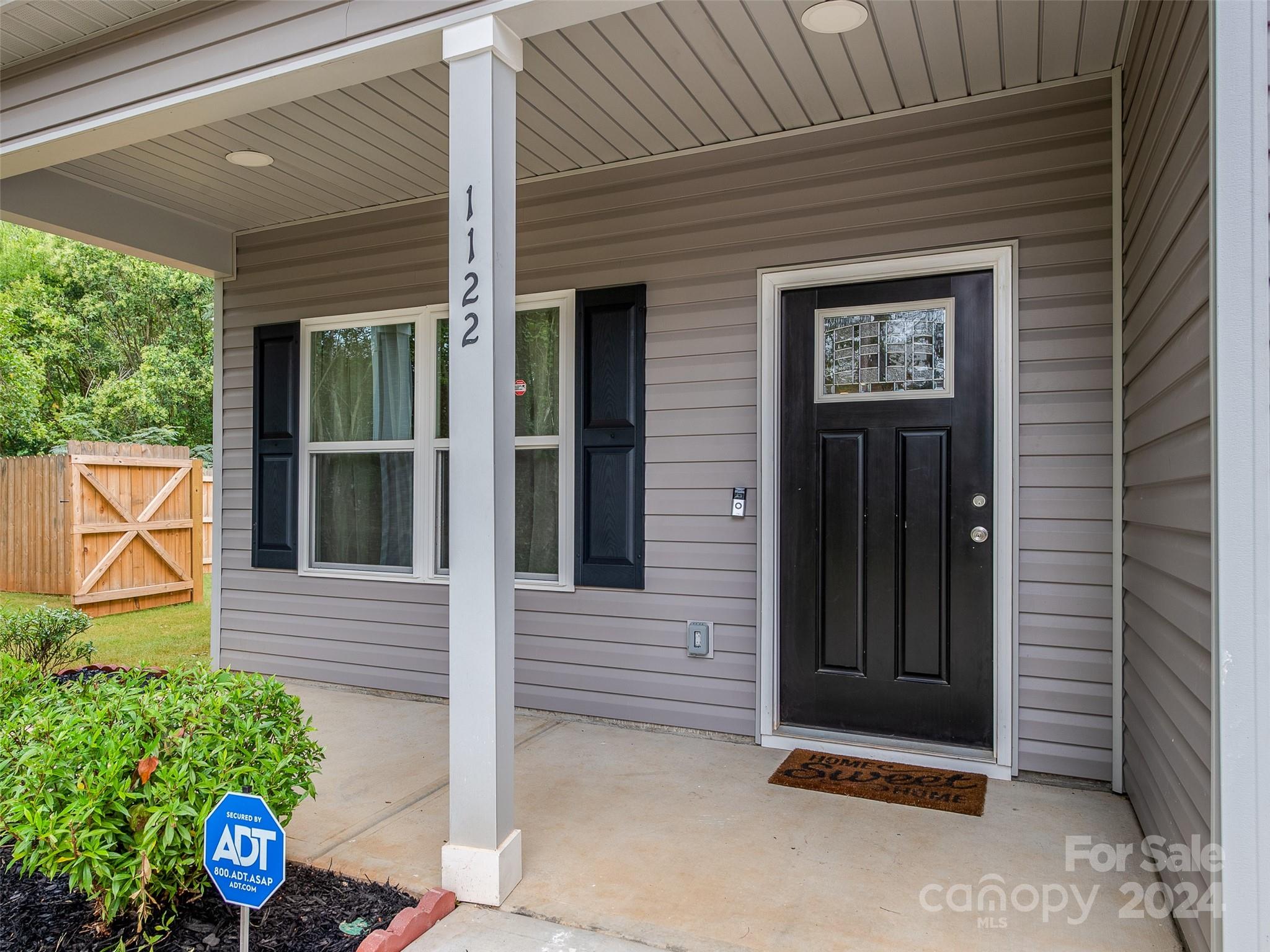 1122 Rhyne Road Charlotte, NC 28214 - Photo 2 of 22 a view of a door of the house