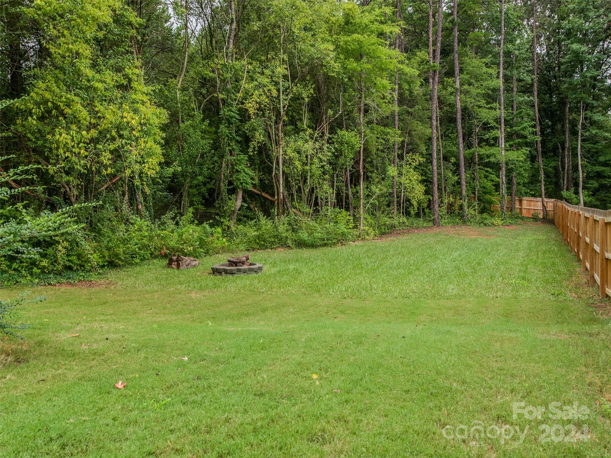 1122 Rhyne Road Charlotte, NC 28214 - Photo 22 of 22 a view of a field with a tree