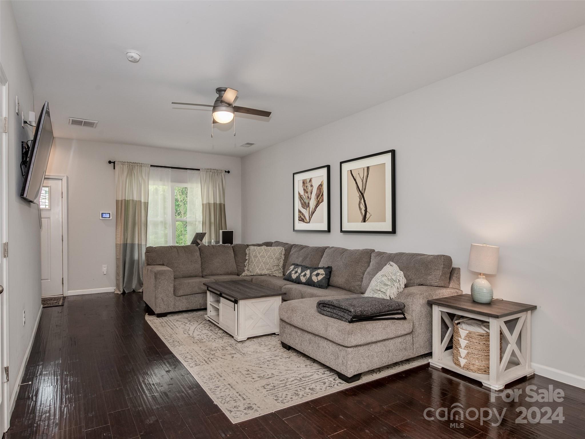1122 Rhyne Road Charlotte, NC 28214 - Photo 6 of 22 a living room with furniture and a ceiling fan