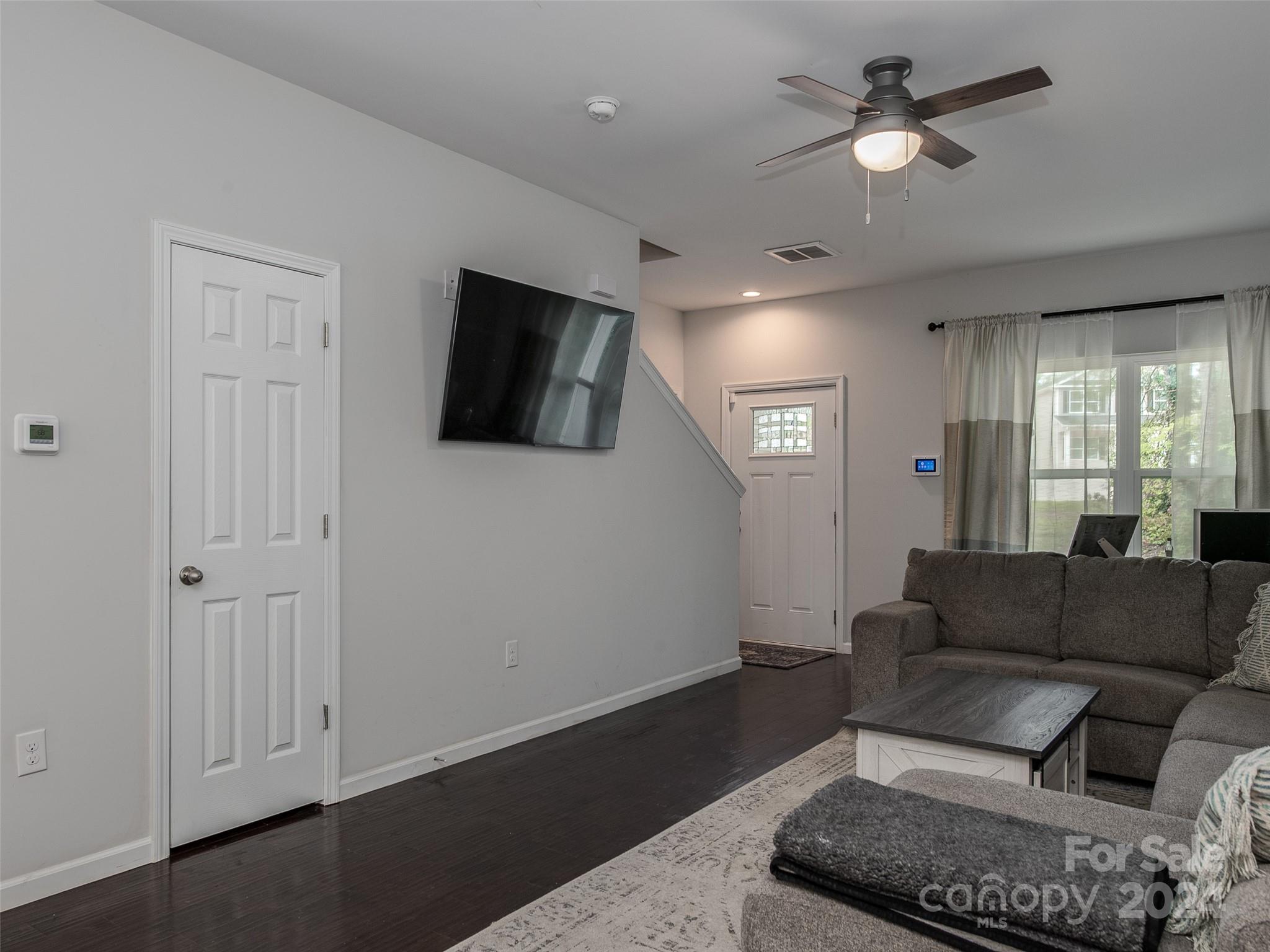 1122 Rhyne Road Charlotte, NC 28214 - Photo 7 of 22 a living room with furniture and a flat screen tv