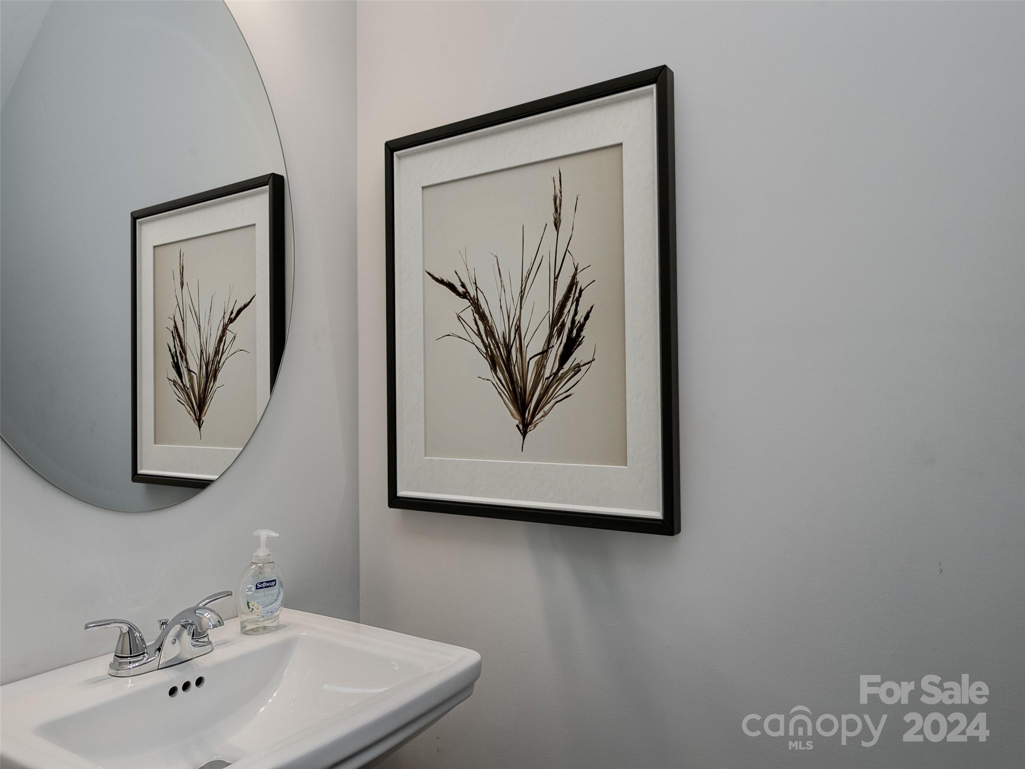 1122 Rhyne Road Charlotte, NC 28214 - Photo 10 of 22 a bathroom with a sink and a mirror