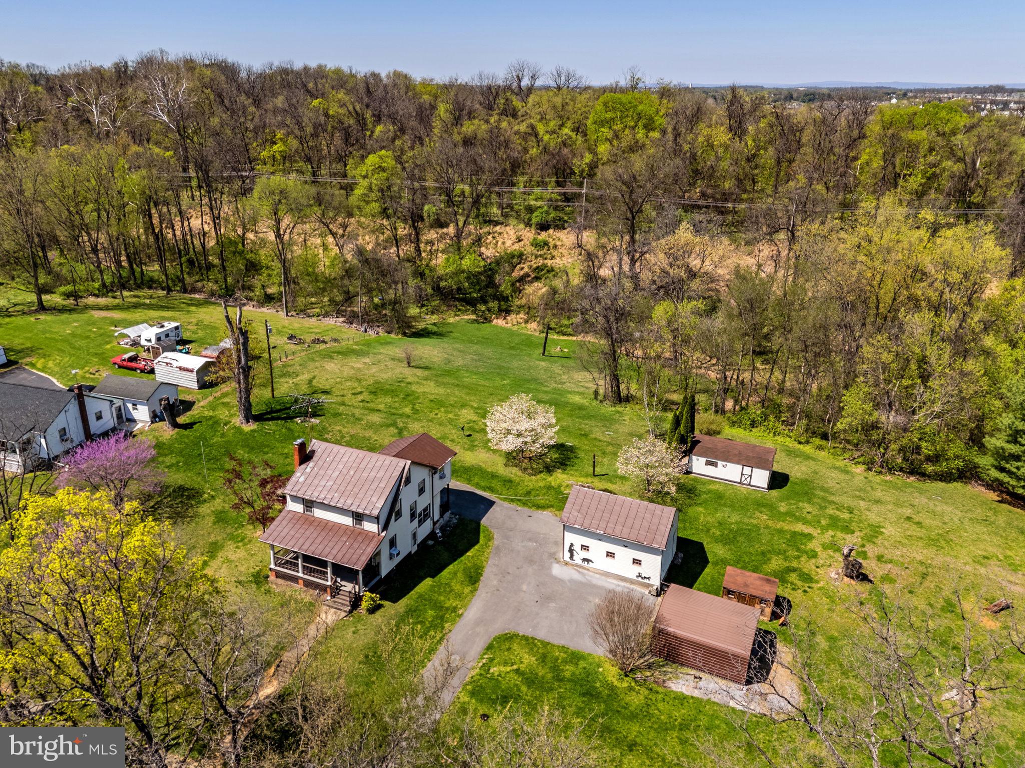 198 Henkle Moore Road Harpers Ferry, WV 25425 - Photo 62 of 73 an aerial view of a house with garden space and street view