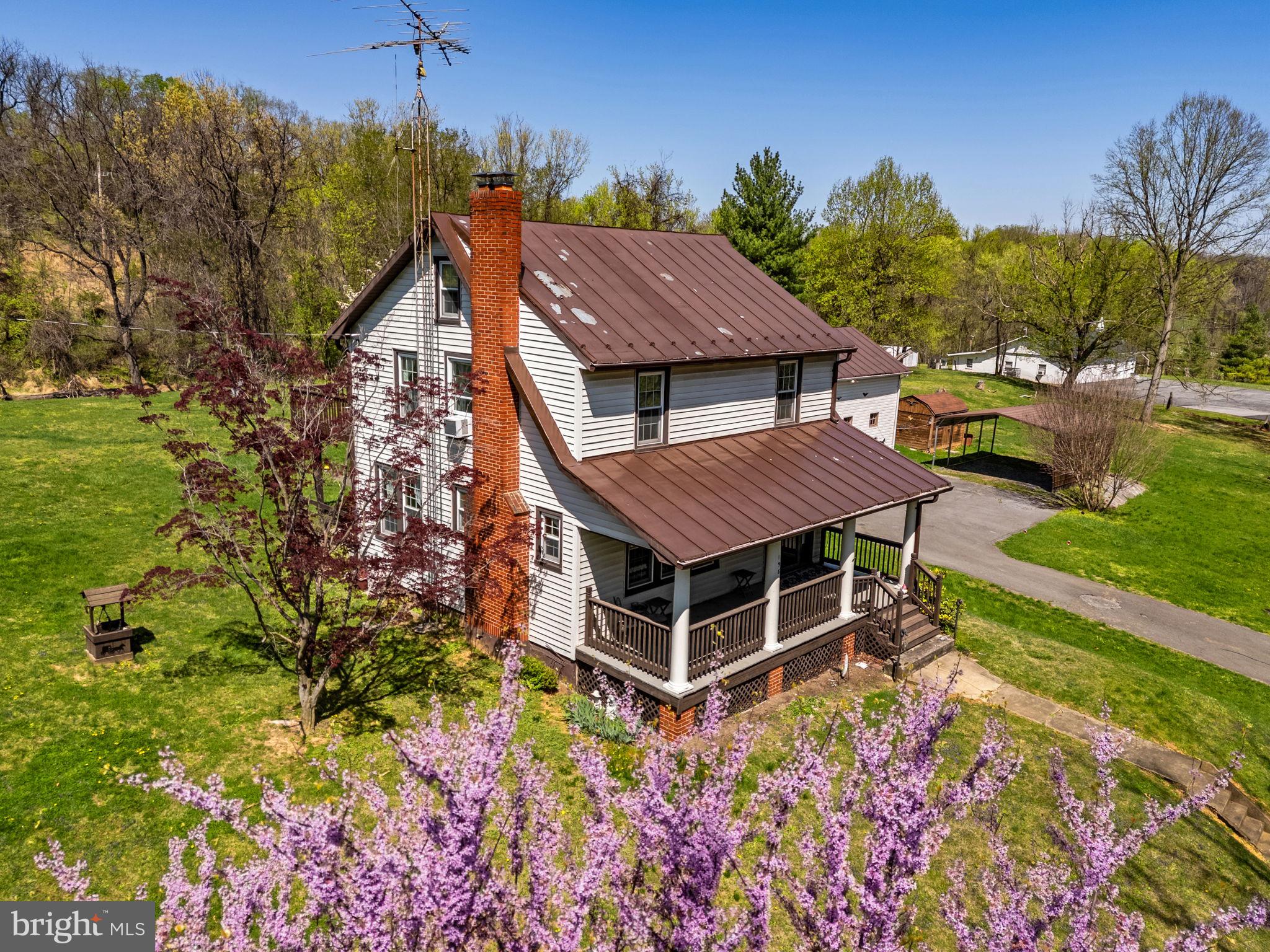 198 Henkle Moore Road Harpers Ferry, WV 25425 - Photo 65 of 73 a view of a house with a yard and garden