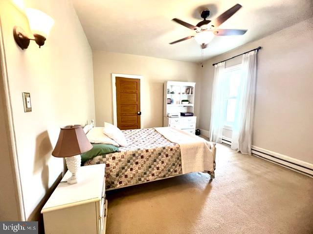225 Niantic Road Barto, PA 19504 - Photo 60 of 82 a bedroom with a bed next to a window with a chandelier