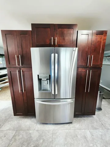 a view of a refrigerator with wooden fence