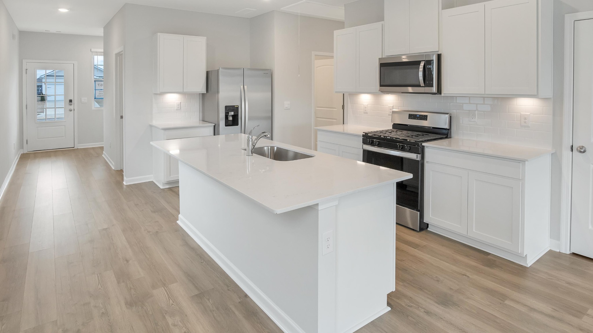 4918 Barnburgh Lane Murfreesboro, TN 37129 - Photo 7 of 24 a kitchen with stainless steel appliances a sink stove and refrigerator