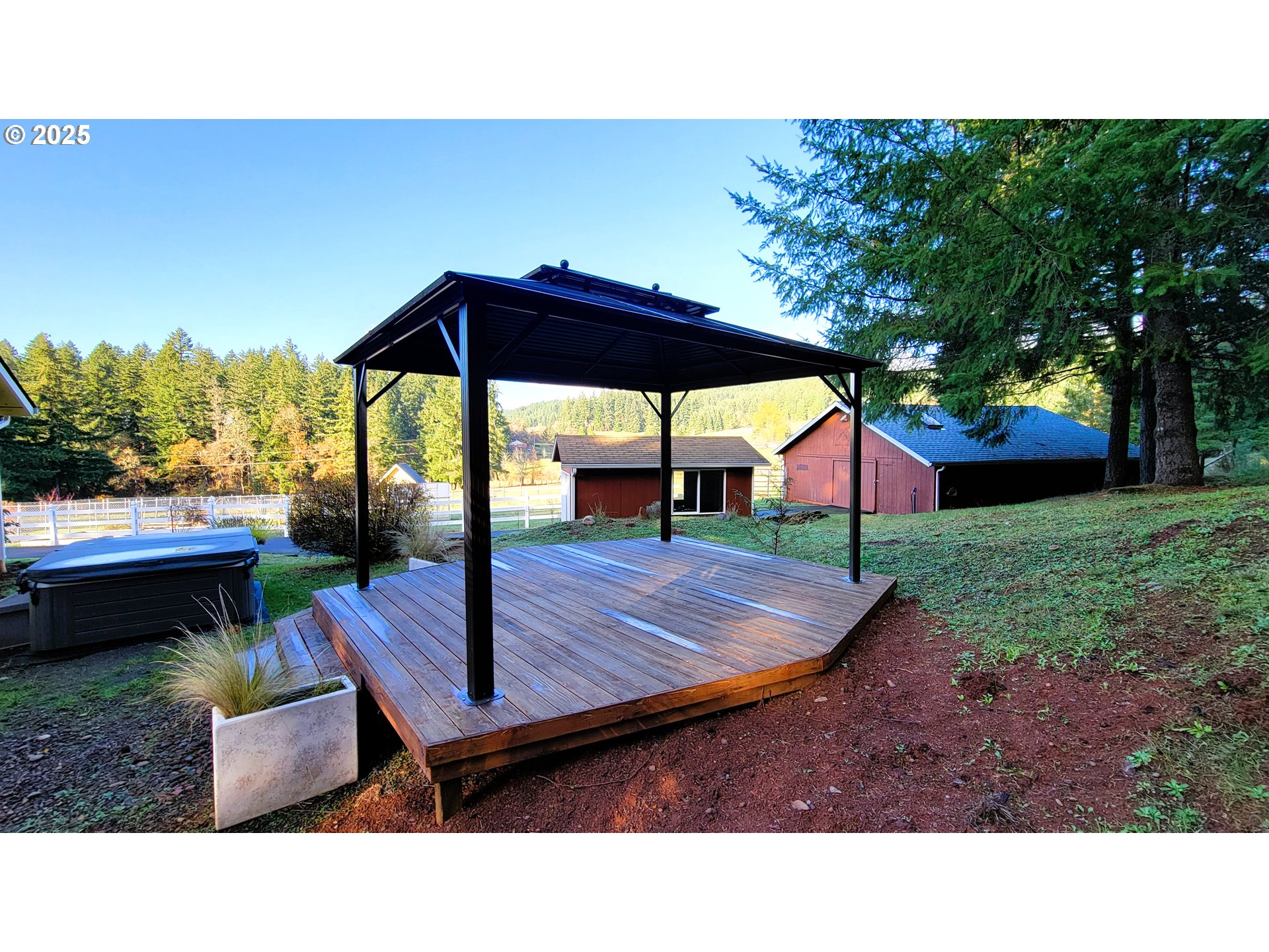 34336 Stewart Hills Lane Cottage Grove, OR 97424 - Photo 28 of 40 a backyard of a house with barbeque oven table and chairs