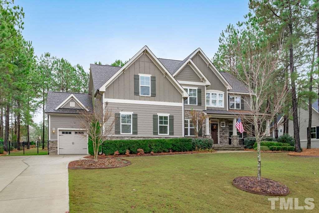 1217 Harrison Ridge Road Wake Forest, NC 27587 - Photo 1 of 30 a front view of a house with a yard